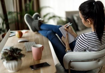 woman making list at home
