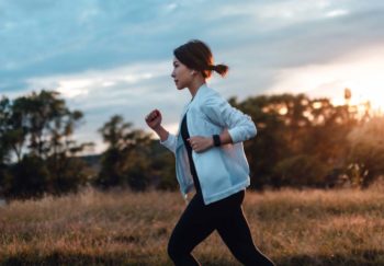 woman running outside not noticing she's thin