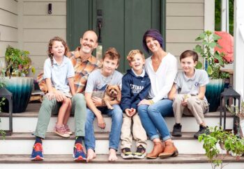 Child who beat leukemia sitting with loving family