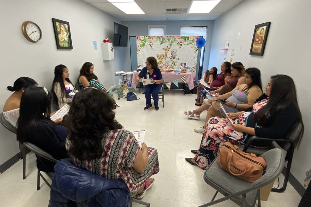 Women sitting in a circle at a baby shower